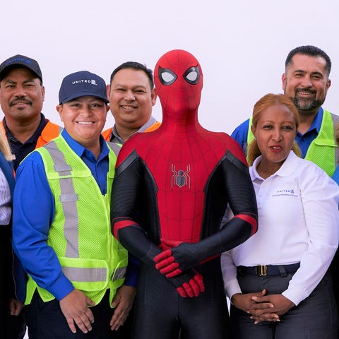 Spider-Man poses with United employees seen in...