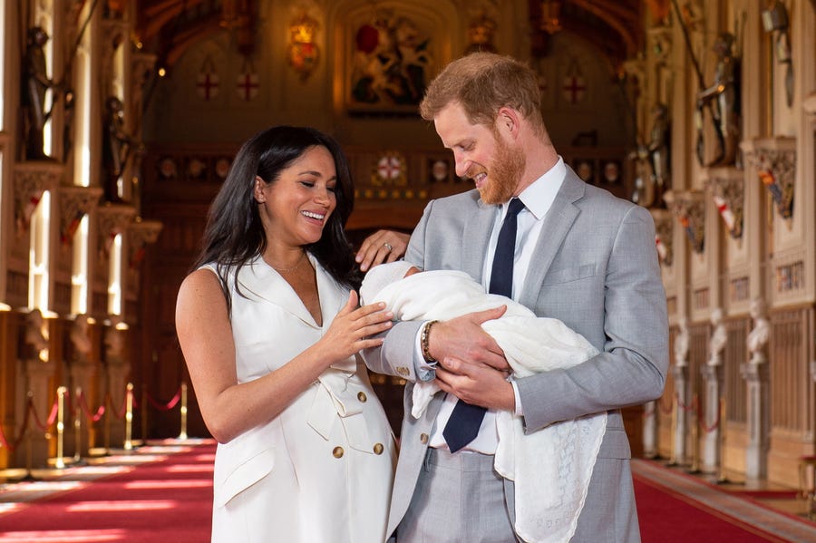 Prince Harry and Duchess Meghan of Sussex pose with their newborn son at Windsor Castle, May 8, 2019.