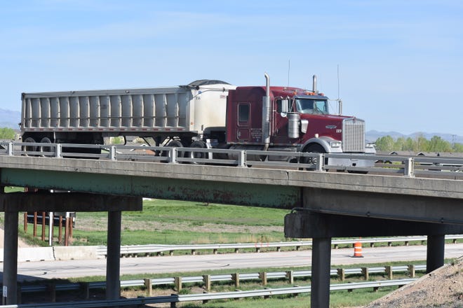 A semi-truck crosses Vine Drive Bridge over Interstate 25 on Tuesday morning. The bridge is scheduled to be rebuilt and will be closed seven months.