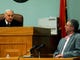 Special Judge James B. "Buddy" Scott shows Rocky Houston his waiver of his right to testify in Roane County Circuit Court on Dec. 16, 2008.