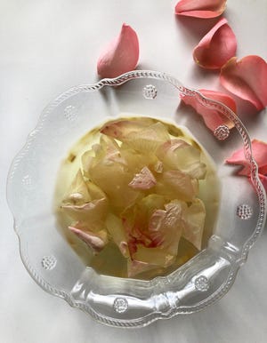 Rose water is easy to make yourself. Simmer until color of the rose petals has faded.