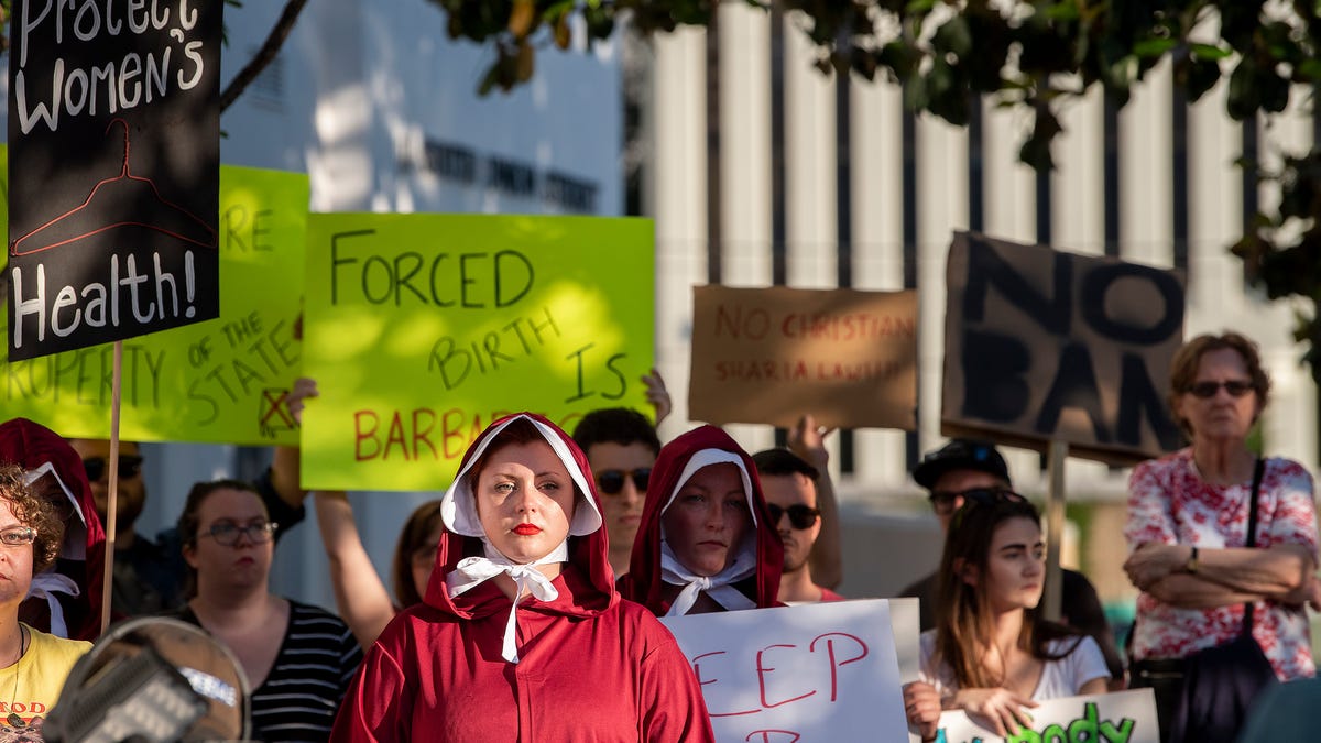 Margeaux Hartline, dressed as a handmaid, during a rally against HB314, the near-total ban on abortion bill, outside of the Alabama Statehouse in Montgomery, Ala., on Tuesday May 14, 2019.