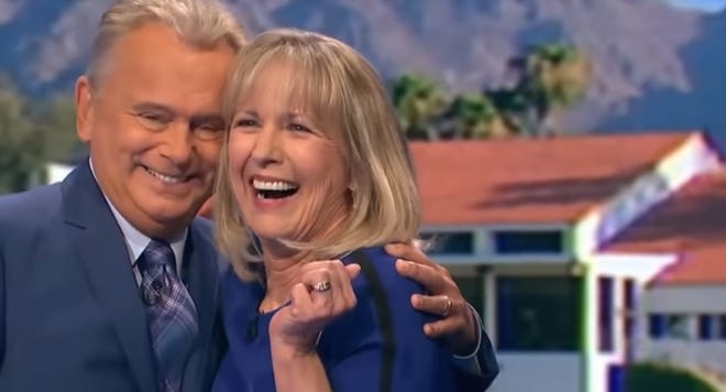 "Wheel of Fortune" game show host Pat Sajak gives Rae Wilson of Las Cruces a hug after she won a trip to Maui, Hawaii, on Monday night's episode.