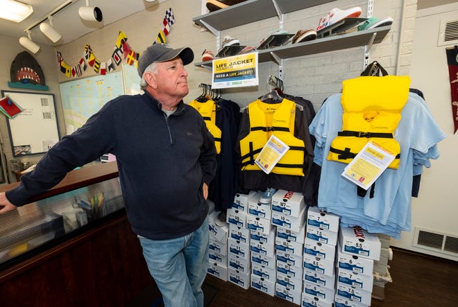 Harbormaster Dave Shorkey stands near a rack of life jackets and T-shirts Tuesday, May 14, 2019, at the St. Clair Harbor. Through a partnership with the Sea Tow Foundation, the St. Clair Harbor has received nearly 50 life jackets that can be borrowed.