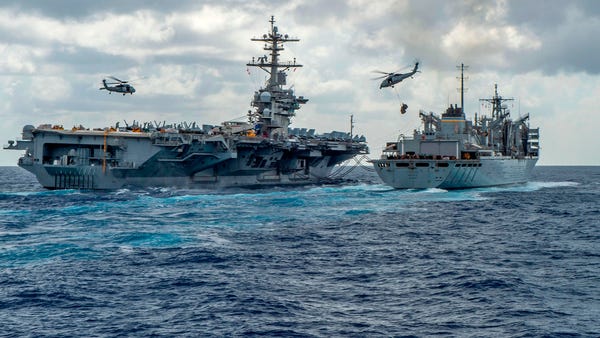 This handout picture released by the U.S. Navy on...