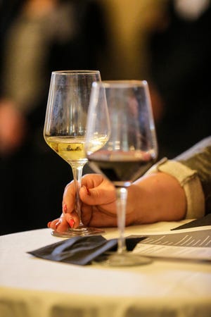 Event attendees drink wine during the Hotel Retlaw grand re-opening celebration in May 2019. Fond du Lac Morning Rotary will host its annual Wine Around the World fundraiser to benefit homeless families Feb. 18 at the hotel.