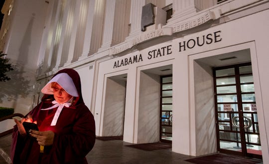 Bianca Cameron-Schwiesow, a protester of the bill on the total abortion ban in Alabama, is disguised as a maid while she was waiting in front of the Alabama residence after HB 314 passed the State Senate in Montgomery, Alabama, on Tuesday, May 14, 2019.
