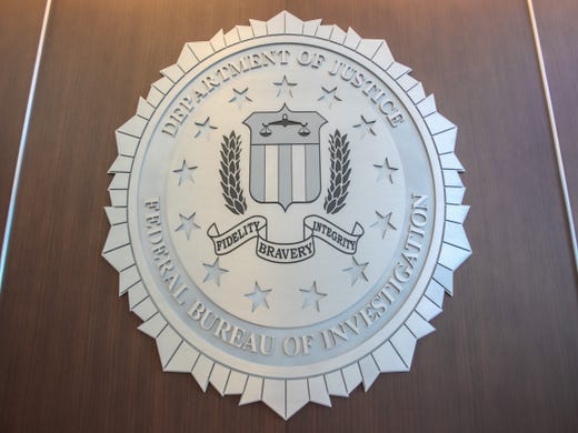 The FBI warns of 'Virtual Kidnapping Scams' luring people over the border at their Phoenix office on May 17, 2019.