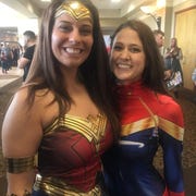 Ashley Vansickle (Captain Marvel, right), 26, asked Deanna Mascia (Wonder Woman), 25, to marry her at Motor City Comic Con on May 18, 2019.