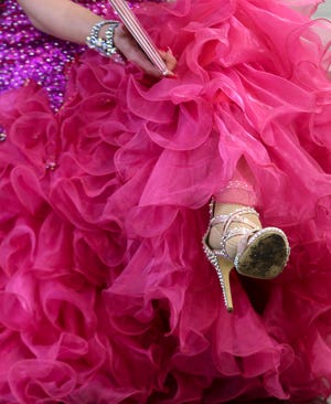 Drag Queen Storytime's Vanessa Demornay reads to the audience at the main Louisville Library on May 18.