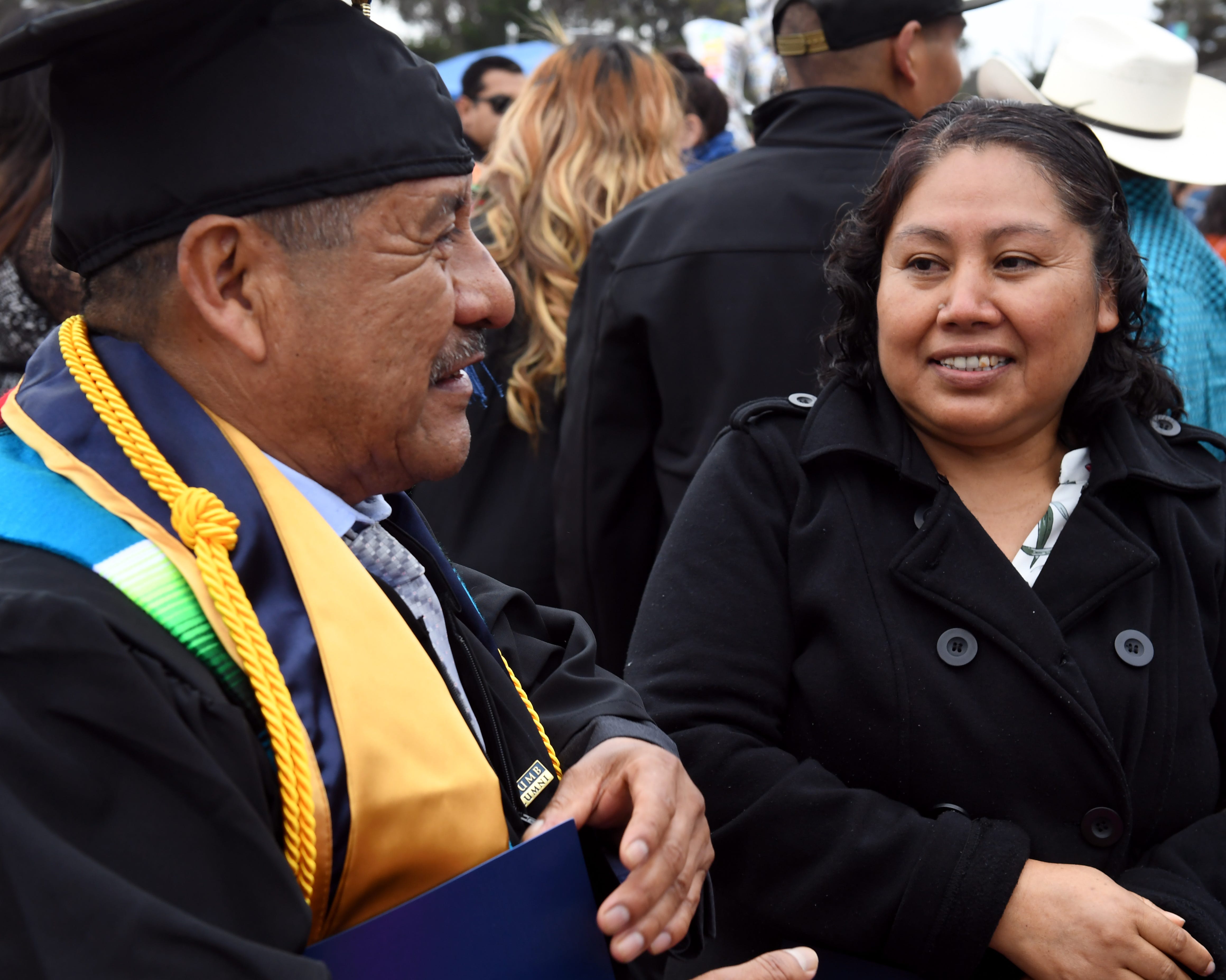 Maria Ibarra González congratulates her husband, Adolfo González, on earning his degree on May 18, 2019.