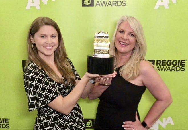 Pictured left to right: Rachel Kerr, Dairy Farmers of Wisconsin, Director of Events and PR and Suzanne Fanning, Dairy Farmers of Wisconsin Senior Vice President and Wisconsin Cheese Chief Marketing Officer accept the Gold REGGIE Award on behalf of Dairy Farmers of Wisconsin.