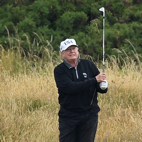 President Donald Trump plays a round of golf at...