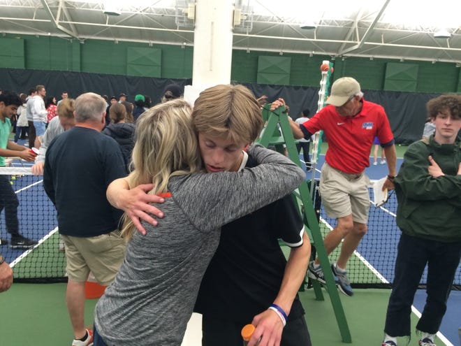 Sprague junior Judson Blair hugs his mother, Rhonda, after falling Saturday in the OSAA Class 6A singles state championship match.
