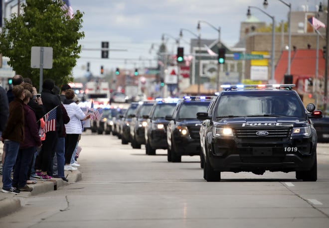 The funeral procession for Appleton firefighter Mitch Lundgaard makes its way down West Wisconsin Avenue.