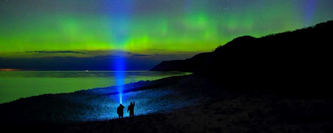 "Aurora Hunters," by Dale Niesen of South Rockwood,  was an Award of Excellence winner in the 2017 contest. Niesen used two LED flashlights, a wide angle lens and a 15-second exposure to create this shot of the northern lights near Empire Bluffs in  Sleeping Bear Dunes National Lakeshore.