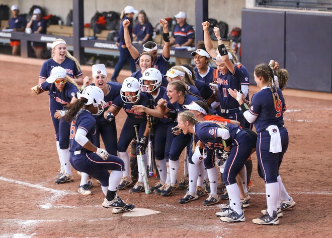 Auburn's Bree Fornis (15) celebrates with teammates after hitting a home run against Arizona on Saturday, May 18, 2019, in Tucson, AZ.