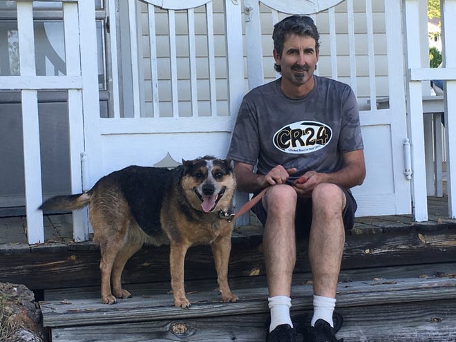 Robert Weller with his dog Zena, which accompanies him to his 24-hour races