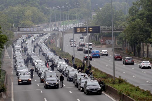 Taxi drivers take part in a blockade on the A6 highway near the Porte d'Orleans, southern Paris, on May 20, 2019, as part of an action along with ambulance drivers and driving school instructors to protest against a draft law on transport. (Photo by Thomas SAMSON / AFP)THOMAS SAMSON/AFP/Getty Images ORIG FILE ID: AFP_1GO4QG