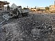 TOPSHOT - A damaged vehicle lies next to a crater cased by reported airstrikes by the Syrian regime ally Russia, in the town of Kafranbel in the rebel-held part of the Syrian Idlib province on May 20, 2019. - According to a war monitor, air strikes by regime ally Russia resumed on the Idlib region late yesterday, after shelling and rocket fire by regime forces earlier in the day killed six civilians. (Photo by OMAR HAJ KADOUR / AFP)OMAR HAJ KADOUR/AFP/Getty Images ORIG FILE ID: AFP_1GO4CB