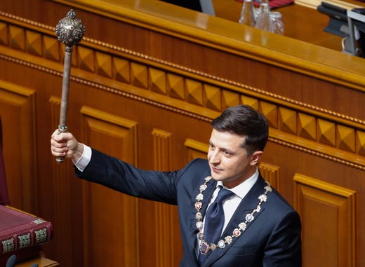 epa07586251 President-elect Volodymyr Zelensky shows an ancient Bulava (historical symbol of the state power) during his inauguration in the Ukrainian parliament in Kiev, Ukraine, 20 May 2019. Volodymyr Zelensky with 73,22 percent of the votes beats out the current President Petro Poroshenko, who received 24,45 percent of the votes during the second tour of Presidential elections in Ukraine which was held on 21 April 2019. EPA-EFE/SERGEY DOLZHENKO ORG XMIT: KIV01