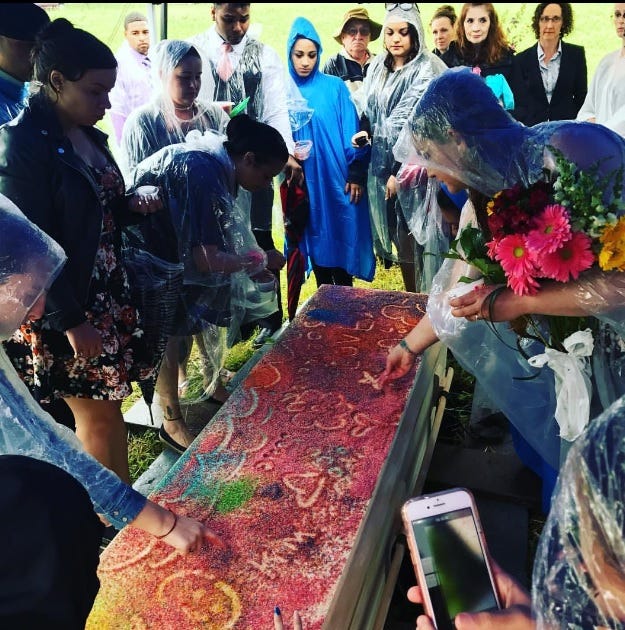 At Josie Berrios' funeral, friends and family drew messages and pictures in colored sugar on top of her casket.