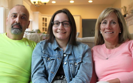 Brie Salloum, center, learned CPR as part of a certified nursing assistant class at Valley High School. She used those skills to save her father's life when he suffered cardiac arrest in the early morning of April 2. Her parents, Ray and Lisa Salloum, are pictured with her.