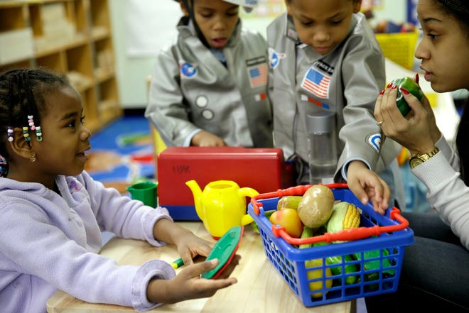 Oumou Balde, 4, learns about nutrition and health in 2014. Kids can improve cholesterol levels by adopting healthier habits _ eating more fruits, vegetables, whole grains and less processed food, and exercising more.