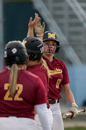 McCutcheon center fielder Kendra Hutchison (9) scores during the third inning of the first round of the 4a Girls Softball Sectional, Monday, May 20, 2019, at Harrison High School in West Lafayette. McCutcheon won, 18-2.
