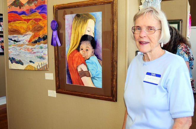 Artist Janet Bishop poses with her Best of Show in the two-dimensional division of the Luna County Fine Arts and Crafts Show held at the Deming Art Center and hosted by the Deming Art Council. The show is currently on exhibit.