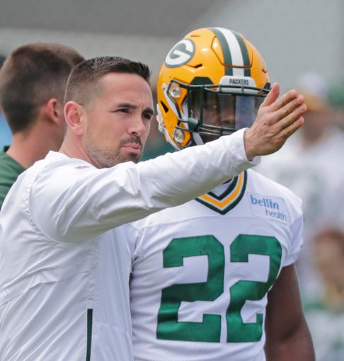 Green Bay Packers head coach Matt LaFleur talks to running back Dexter Williams (22) during practice at Clarke Hinkle Field on Tuesday, May 21, 2019 in Ashwaubenon, Wis.
Adam Wesley/USA TODAY NETWORK-Wis