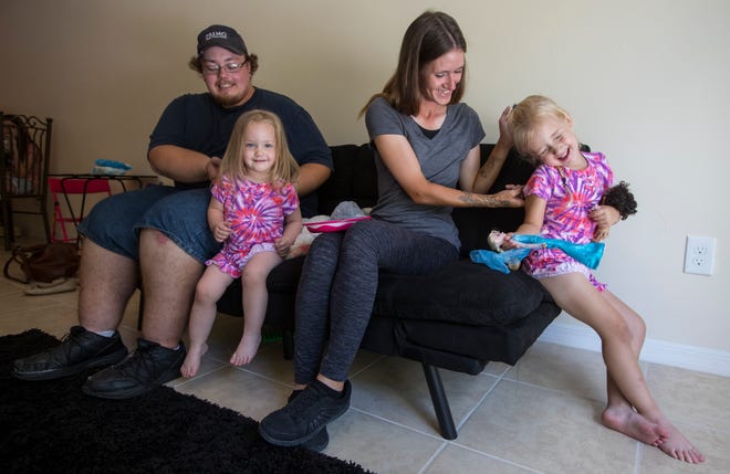 Jonathon Tobbe and Shasta Hardesty play with their daughters Emarah Tobbe, 2, and Lunayrah Hardesty, 4, Wednesday afternoon, May 22, 2019 at their home in Cape Coral. The couple was reunited with their young daughters who had been in foster care for the past two years.