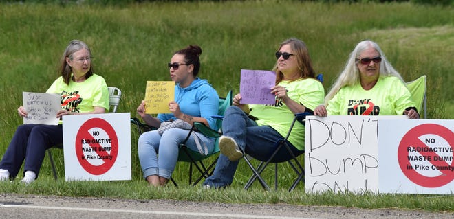 Protesters gather outside the Pike County YMCA Tuesday to show their disapproval of the low-level nuclear waste disposal site at the now deactivated Portsmouth Gaseous Diffusion Plant.