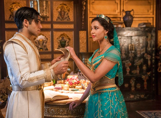 Mena Massoud as Aladdin, left, and Naomi Scott as Jasmine in Disney's live-action adaptation of the 1992 animated classic "Aladdin." The movie opens Thursday at Regal West Manchester, Frank Theatres Queensgate Stadium 13 and R/C Hanover Movies.