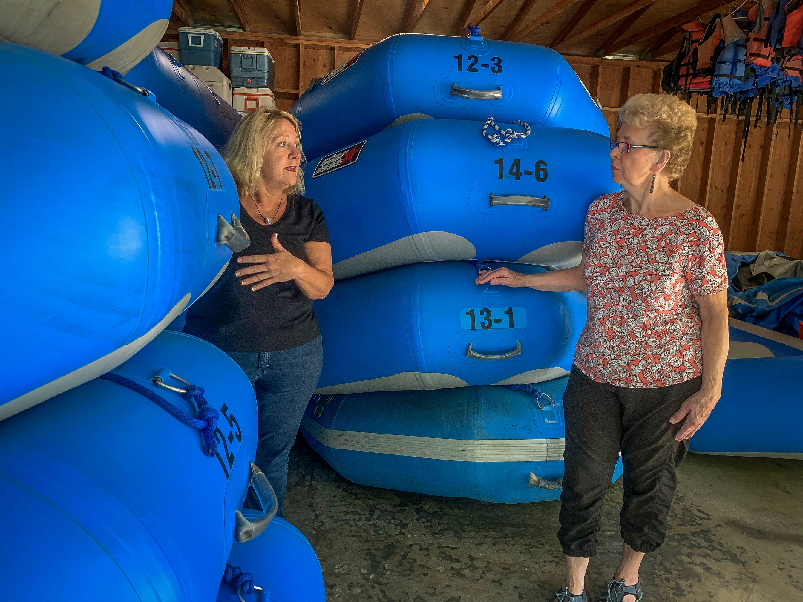 Debbie Thomason, left, and her mom, Mary Lou Thomason, work in the boathouse at the Galice Resort in Merlin, Oregon getting rafts ready for the beginning of their season along the Rogue River. The resort, owned by the Thomason family since the early 1980s, had to close its doors for over a week due to threat from wildfires in 2018. The popular destination lost revenue and had to lay off employees due to the closure.