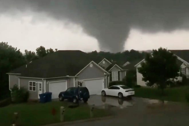 This still image taken from video provided by Chris Higgins shows a tornado in Carl Junction, Mo., on Wednesday, May 22, 2019. The tornado caused damage in the town about 4 miles north of the Joplin airport.