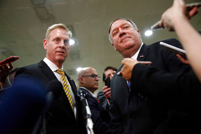 Acting Defense Secretary Patrick Shanahan, left, and Secretary of State Mike Pompeo speak to members of the media after a classified briefing for members of Congress on Iran, Tuesday, May 21, 2019, on Capitol Hill in Washington.