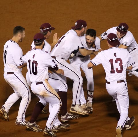 Mississippi State players celebrate the Bulldogs'...