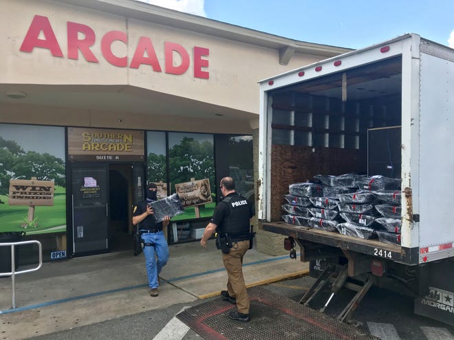 FILE ART: Officers load up confiscated equipment at the Southern Amusement Arcade as part of raids conducted on suspected gambling houses Thursday, May 23, 2019. The raids were part of joint operation of the Tallahassee Police Department and the Leon County Sheriff's Office.