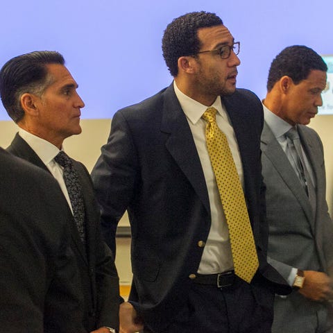 Kellen Winslow is flanked by his attorneys, Brian...