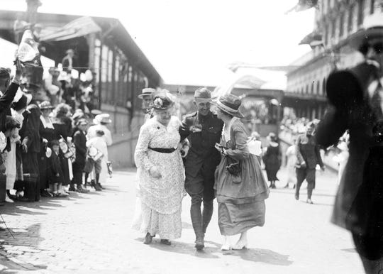 A returning soldier from the 339th Infantry is reunited with loved ones on July 3, 1919, at Michigan Central Depot in Detroit. Many of the Polar Bears never made it home.