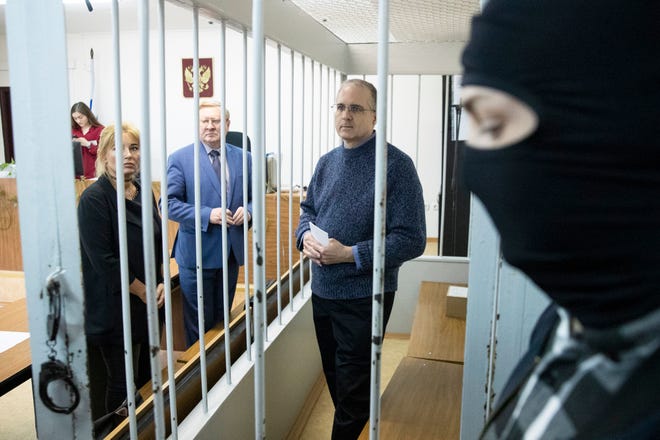 Paul Whelan, a former U.S. Marine, center, who was arrested in Moscow at the end of last year, waits for a hearing in a court in Moscow, Russia, Friday, May 24, 2019.