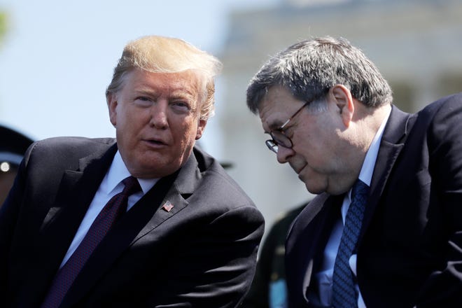 In this May 15, 2019, file photo, President Donald Trump and Attorney General William Barr speak at the 38th Annual National Peace Officers' Memorial Service at the U.S. Capitol in Washington.
