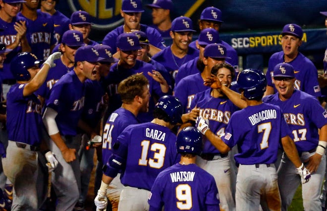 LSU's Giovanni DiGiacomo (7) celebrates with his team after hitting a two run homer during the eighth inning of the Southeastern Conference tournament NCAA college baseball game against Mississippi State, Wednesday, May 22, 2019, in Hoover, Ala. (AP Photo/Butch Dill)