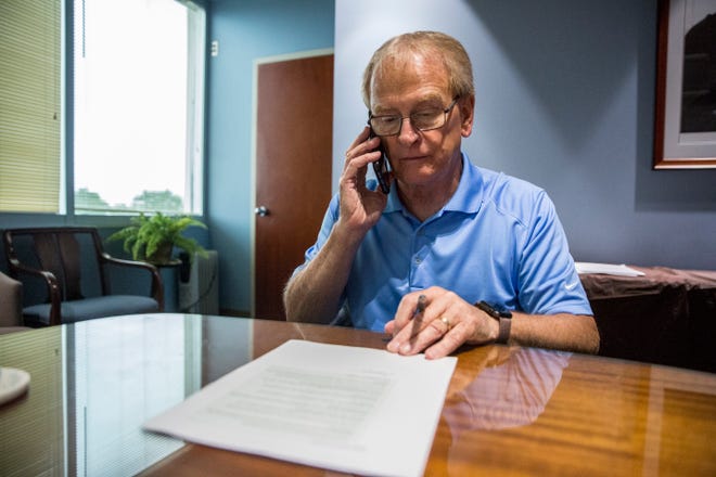 Mayor Dennis Tyler makes a quick phone call after a nearly hour long interview with the Star Press.