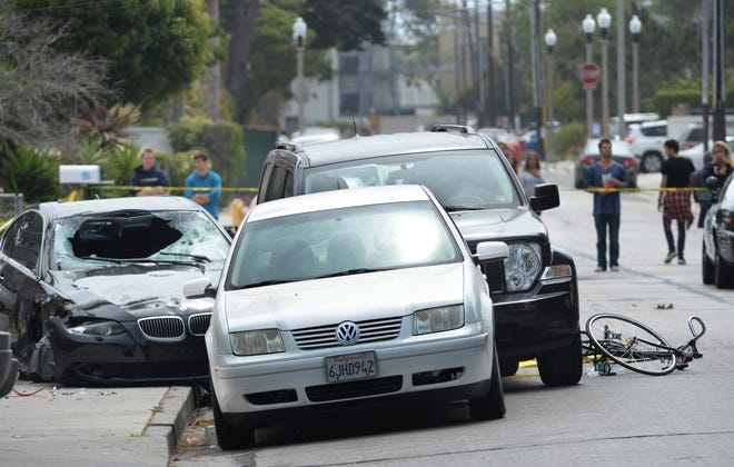 This BMW, left, driven by a drive-by shooter who killed six people and himself, is shown in Isla Vista on May 24, 2014.