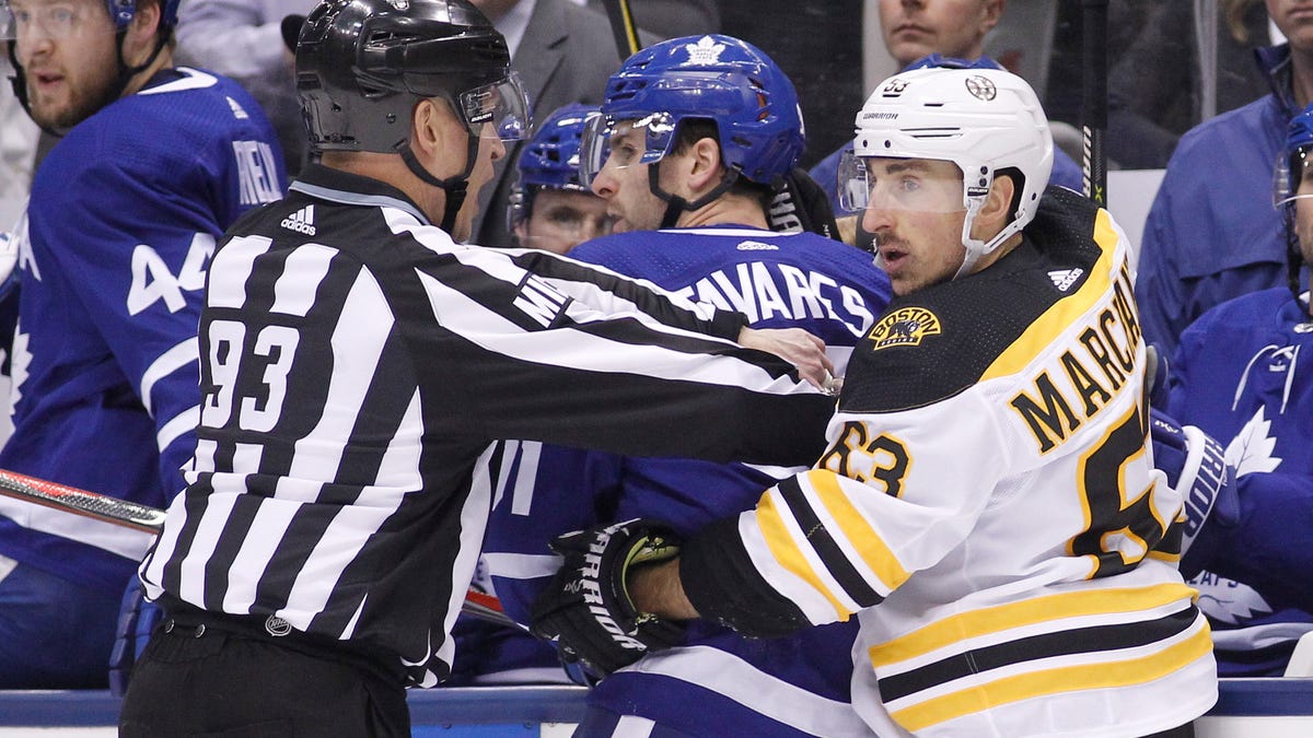 Brad Marchand mixes it up near the Maple Leafs bench during the first round of the playoffs.