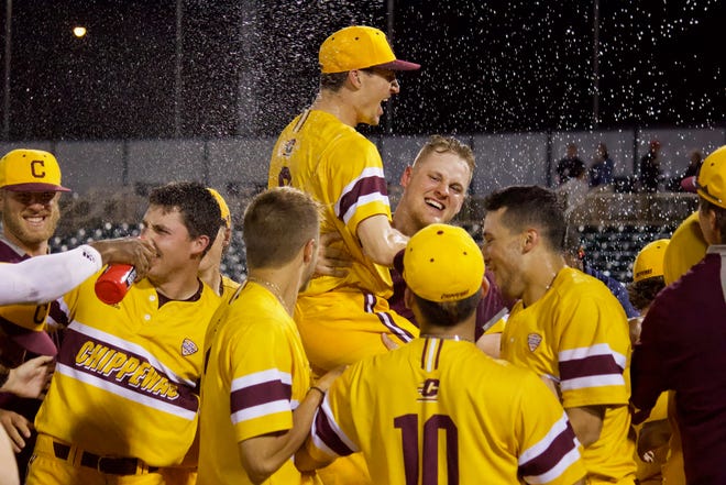 The Central Michigan baseball team celebrate after winning the program's third MAC tournament title with a 6-0 win over Ball State on Saturday.