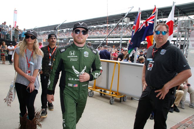 Conor Daly enters the track area for driver introductions prior to the start of the 103rd Indianapolis 500, Sunday, May 26, 2019.