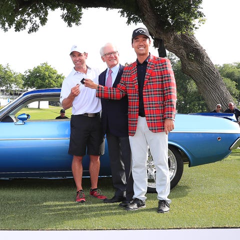 Kevin Na and caddie Kenny Harms pose for a photo.